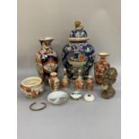 Chinese and Japanese pottery vases and a marble bust of a native man