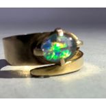 An opal doublet ring, the oval cabochon stone claw set and applied to a tapered cross over expanding