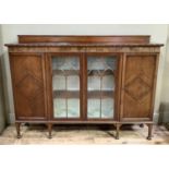 1920's mahogany bookcase, having a short raised back above two tracery glazed doors flanked by a