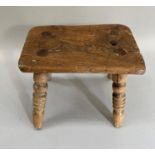 A 19th century elm stool, rectangular seat on turned legs