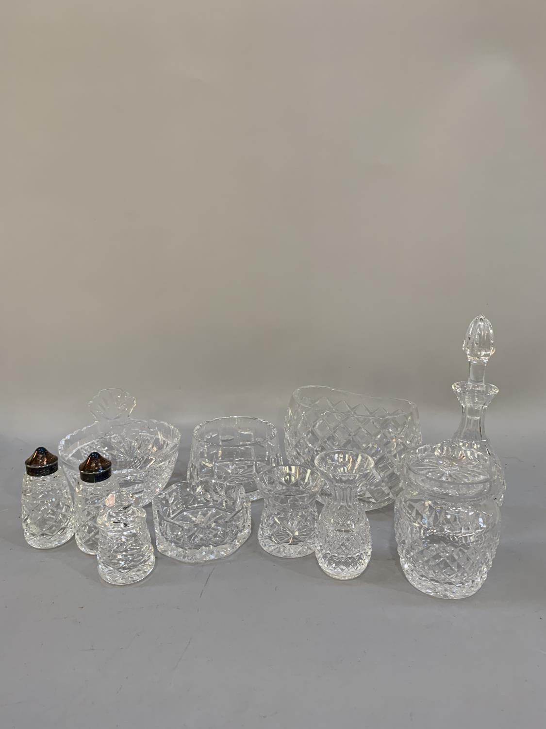 A collection of Waterford crystal including salt, pepper, vinegar and mustard, ashtray, preserve pot