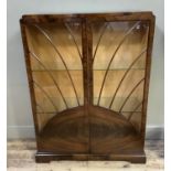 A 1930's/40's mahogany two door display cabinet of sunray design, 96cm wide by 35cm deep by 125cm