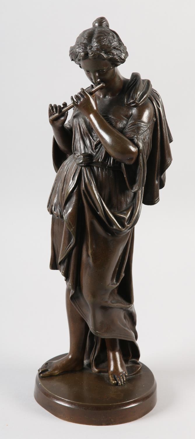 A 19TH CENTURY BRONZE FIGURE OF A CLASSICAL FEMALE, standing, playing a flute, on circular plinth,