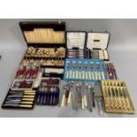 A quantity of EPNS cutlery in fitted cases and boxes including a canteen of fish knives and forks