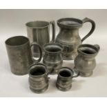 A James Yates pewter baluster mug and various pewter measures