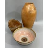 A studio pottery bowl finely potted with an off white and blush crackle glaze, bordered in pale