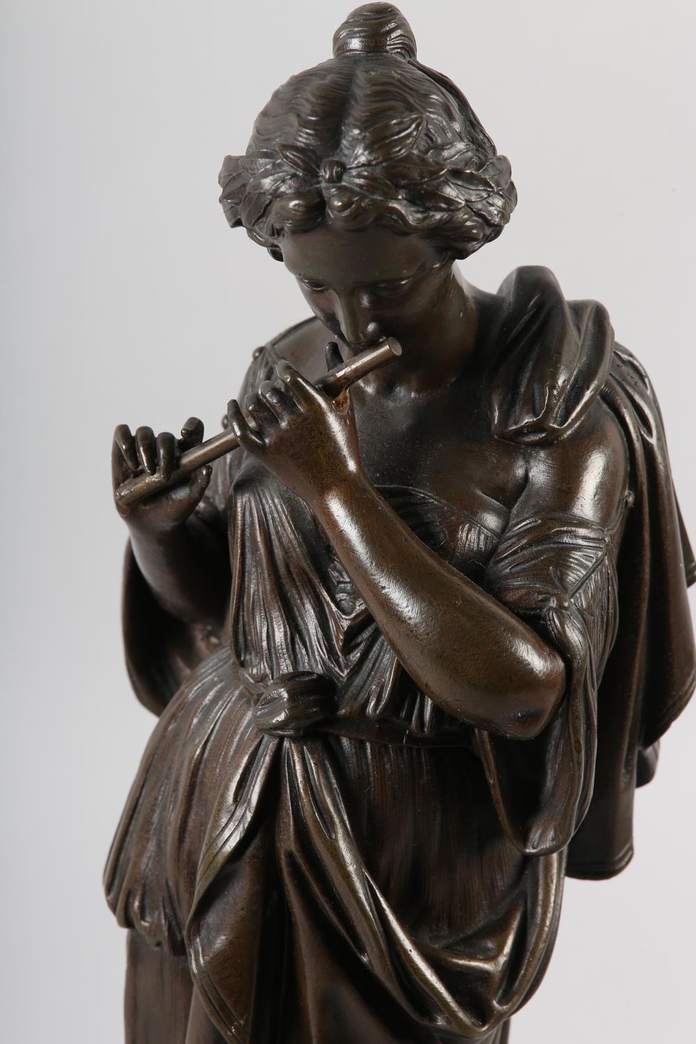 A 19TH CENTURY BRONZE FIGURE OF A CLASSICAL FEMALE, standing, playing a flute, on circular plinth, - Image 2 of 3