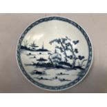 A Worcester blue and white saucer dish painted with chinoiserie scenes of pagoda and blossom