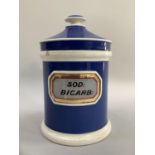 Ceramic chemist's jar and cover with original label SOD: Bicarb: with blue glaze