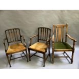 Pair of oak rail back carvers with mustard coloured drop in seats together with further oak carver