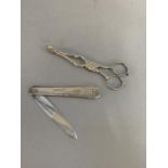 A Victorian silver fruit knife, the silver grips foliate scroll engraved and monogrammed LC with