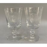 A pair of Brierley glass goblets, etched with the Pisces zodiac sign, etched with Brierley to the