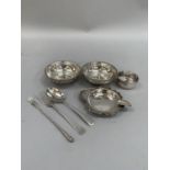 A pair of George V silver dishes with pierced tops and hound tooth rims, each approximate diameter