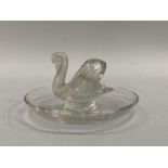 A Lalique glass trinket dish with glass swan raised to the centre, signed Lalique, France to