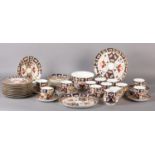 A ROYAL CROWN DERBY TEA SERVICE, 2407 pattern, comprising twelve cups and twelve saucers, twelve tea