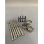 Three matching George V silver napkin rings each foliate engraved and initialled I, Hallmarked