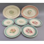 Seven Susie Cooper plates including Tiger Lily, Dresden spray and Rose within green banded borders