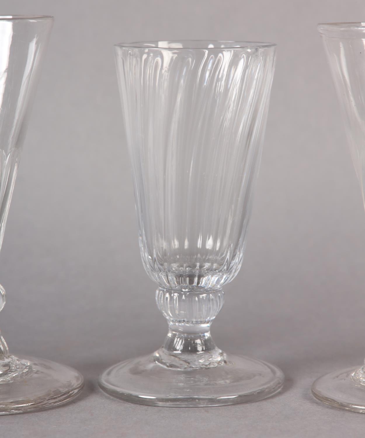 Five early 19th century cordial glasses, four with trumpet bowls on a basal knop stem and circular - Image 5 of 5