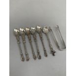 Five continental silver apostle spoons together with a continental silver coffee spoon with a