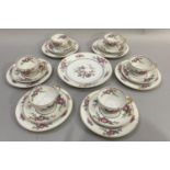 Limoges tea set decorated with floral sprays and exotic birds comprising cups, six saucers, side