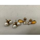 Two pairs of ear studs each in 9ct gold, variously set with citrean and cultured pearls, total