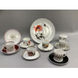 A Susie Cooper coffee can and saucer of uncommon sponge decoration in brown and black on white,