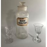 Large chemist jar with stopper with original magnesium label, two early 19th century wine glasses
