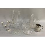 A quantity of cut glass including fruit bowls, decanters, candlestick, jug, pewter tankard and a