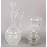 A VICTORIAN CUT WINE EWER, having a faceted neck above cut oval panels, a band of etched grapevine