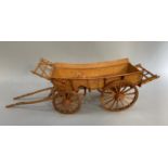 A model of a hay cart in oak, 89cm long overall x 24cm