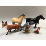 A collection of Beswick animals including large fox running, black glazed mare 'Dene Dauntless',