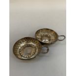 Two early 20th century French .950 silver wine cups, each approximate diameter 7cm with loop handles