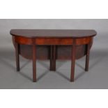 AN EARLY 19TH CENTURY MAHOGANY SINGLE DROP LEAF DINING TABLE, rectangular with rounded profile, on