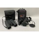 Fujifilm digital camera, FinePix S8600 in case with lens cover together with Zeiss binoculars,