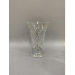 A Waterford crystal flower vase with scalloped rim and circular foot