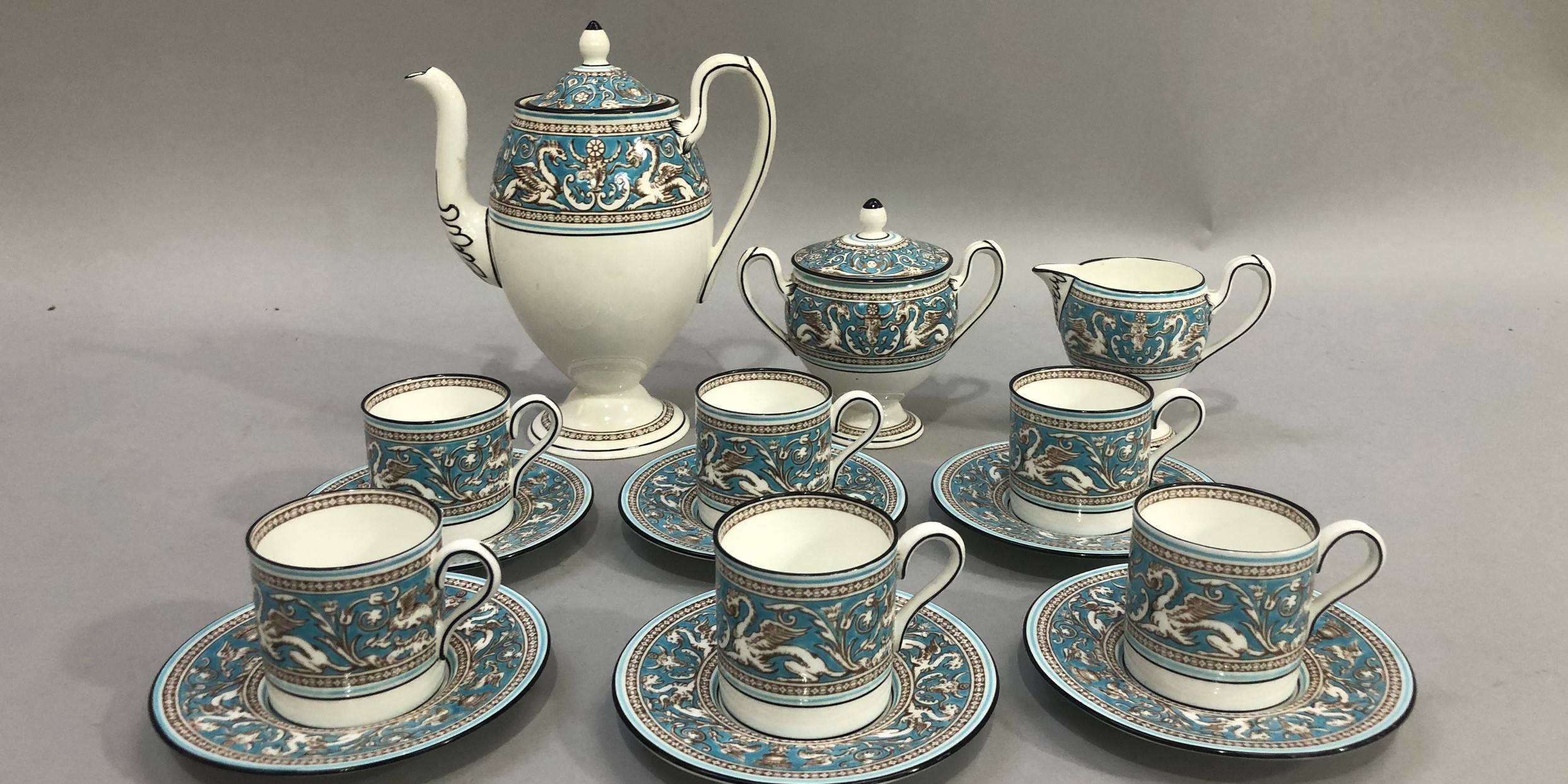 A Wedgwood Florentine coffee service comprising coffee pot, lidded two-handled sugar, cream jug, six