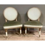 A pair of sirram bedroom chairs, white edged in gilt with green velvet upholstered sprung seats