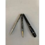 An Italian black cased fountain pen, a vintage grey marble cased propelling pencil and one other