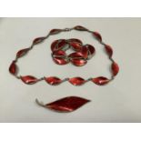 A suite of David Andersen silver gilt and wire red guilloche enamel jewellery including necklace,