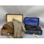 A vintage brown leather suitcase, and a blue suitcase, containing a 1920’s Harrods overcoat, a
