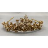 A tiara of graduated gilt beads and facetted paste beads set in a naturalistic form