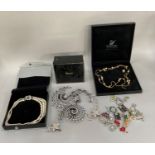 A collection of costume jewellery including four fascinators, a simulated pearl and paste cluster,