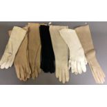 Eight pairs of gloves in various shades of cream: a pair of gaunlets, hand finished; another by