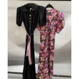 A full-length floral-patterned evening gown with small collar, puff sleeves, scalloped detail to the