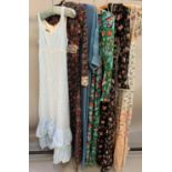1970’s maxi dresses, mainly floral: a cream/floral cotton dress, short sleeved, lace to the