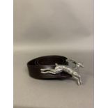 A black leather belt with heavy cast pewter buckle ornament of a running hare, probably by Janie