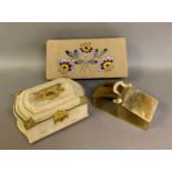 Three decorative boxes for accessories, the first rectangular, embroidered on the fabric top and