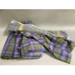 A quantity of lightweight wool fabric in purple and olive plaid