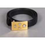 Chanel: Rare, a black leather belt” Lucky Charms” with rectangular gold metal buckle, embossed in