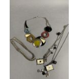 A composite and chrome base metal necklace by Jaeger, approximate length 57cm together with a